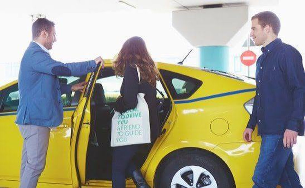 Umrah taxi service driver greeting pilgrims